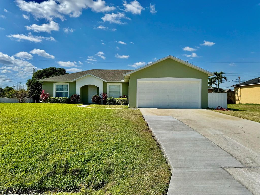 Photo of 452 SW Tarra Avenue, Port Saint Lucie, FL 34953 (MLS # R10981815)