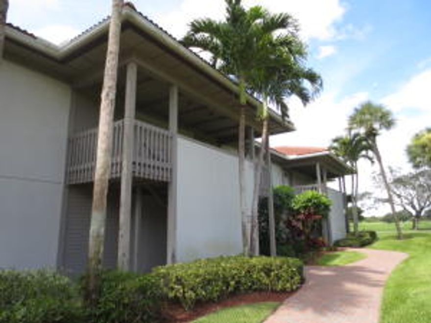 Seller is offering buyers $35,000 towards membership fees! Great top Floor 2 bed 2 bath unit with two master suites, granite kitchen counters, tile floors in the living area, and a screened patio with tennis, golf and lake views. Boca West is a gated country club community featuring four 18-hole championship golf courses, 31 Har-Tru tennis courts, sports center with a waterfall pool, pool bar, and children's area, multi-purpose fitness center and aerobics studio, a spa, and a clubhouse with dining and activities. Mandatory $70k membership required.