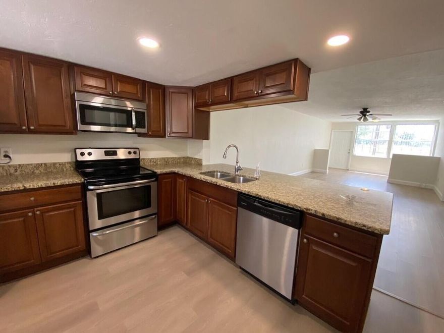 This is a beautiful remodeled first floor unit with water and golf course view. Kitchen features stainless steel appliances, updated cabinets, granite countertops, pantry and hi hat lights. Large countertop to allow for bar stool seating. New Luxury Vinyl flooring throughout the house. Master bedroom has remodeled bathroom with dual sinks! Master bedroom has large walk in closet. Second bedroom is large and has large closet. Guest bathroom is remodeled and has a jacuzzi tub. Indoor laundry room with full size washer and dryer. Community pool, trucks allowed and pets allowed on a case-by-case basis.