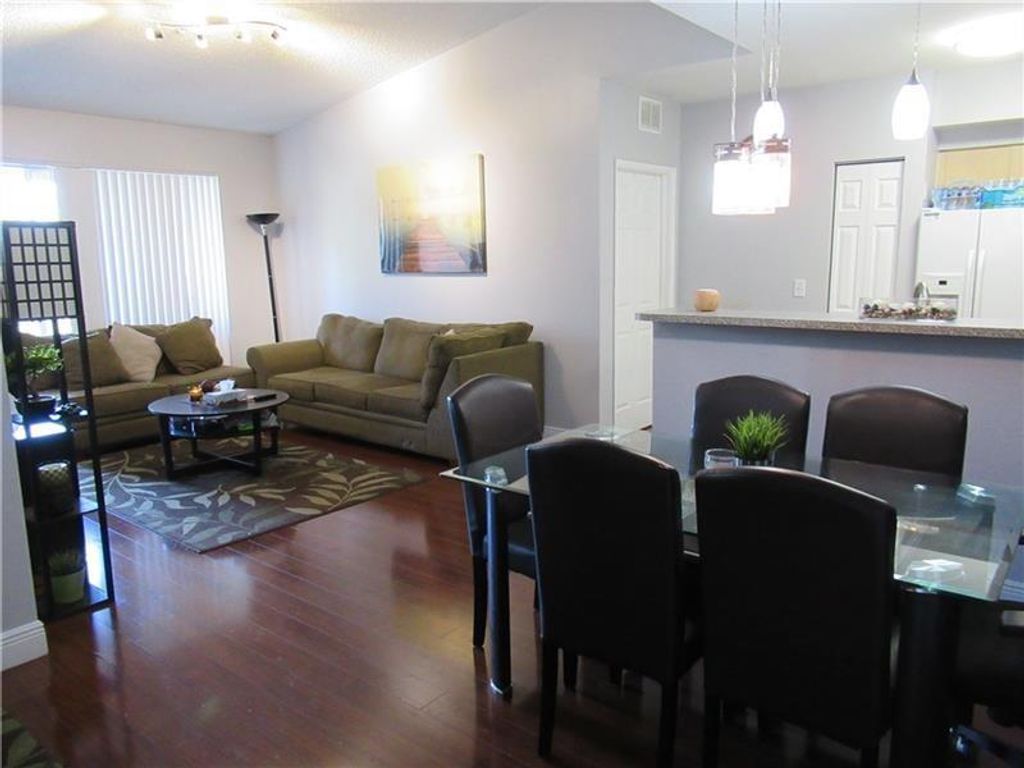 Photo of 8020 N Nob Hill Rd #303, Tamarac, FL 33321 (MLS # F10274012)