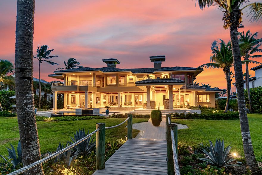 Sensational oceanfront estate in prestigous Sailfish Point boasts 140' direct waterfrontage on .94 acres with sweeping views of the ocean.  This spectacular modern home showcases double height ceilings over a grand living rm. and custom 
bar perfect for entertaining.  The remodeled kitchen is a chef's delight! The downstairs features two spacious oceanfront ensuite bedrooms for your guests enjoyment.  Custom iron/wooden staircase takes you to the 2nd floor master suite w/expansive closet space & private terrace, 2 guest ensuite bedrooms, media rm., and office.  Elevator.  Experience magnificent 2nd flr. views of the ocean from both master & guest suites.  Updated Creston system.  4 car environmentally controlled garage with room for golf carts. Cabana bath. Private entry walkway to beach. This home comes fully furnished inclusive of a beautiful Pramberger piano for your enjoyment.  Sailfish Point Club offers a Marina & Yacht club for up to 125 ft. yacht, Jack Nicklaus golf course, first class fitness & spa, exquisite Members dining club.

Oceanfront living with a world class experience.  This palatial residence is a Florida delight and must See!