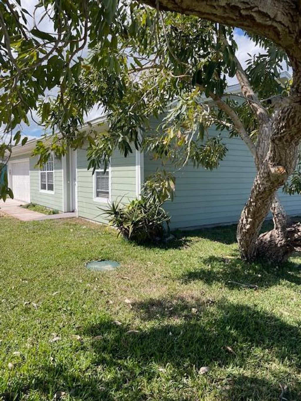 Photo of 1001 SW Dartmouth Avenue, Port Saint Lucie, FL 34953 (MLS # R11043220)