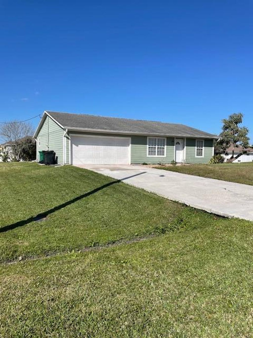 Photo of 1001 SW Dartmouth Avenue, Port Saint Lucie, FL 34953 (MLS # R11043220)