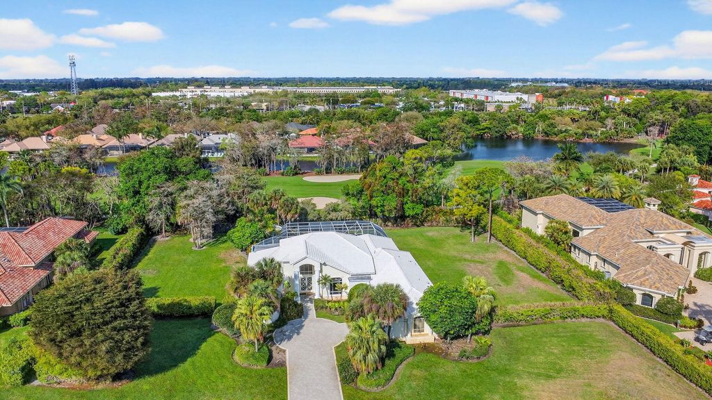 Photo of 1711 Breakers West Boulevard, West Palm Beach, FL 33411 (MLS # B26003100)