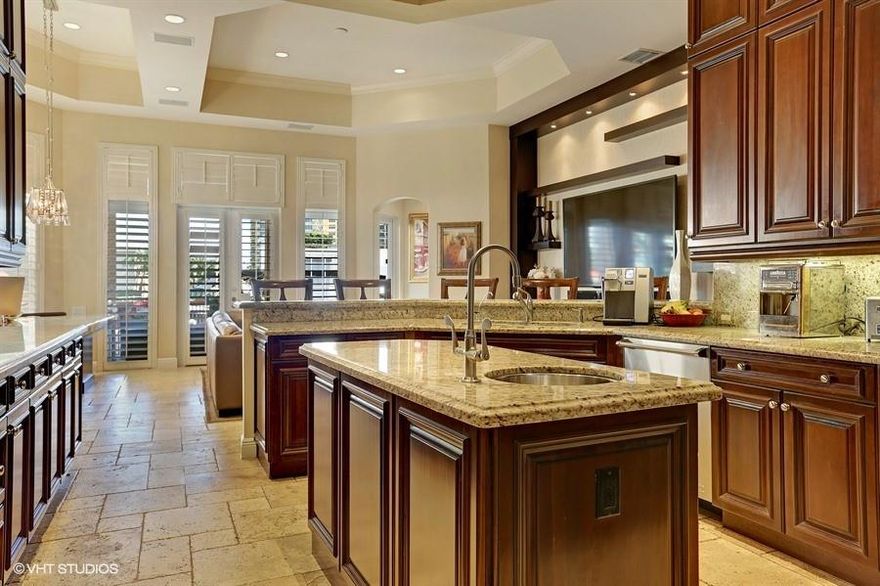 Harbor Islands a gated Community.  Two story waterfront on the Intracoastal Waterway. Largest corner lot on Windjammer Way. Large master suite with sitting room bath and walk in closets. Large family room, library, custom fireplace.   Built in summer kitchen, dock, davits surround beautiful patio on the Intracoastal. This is a one of a kind waterfront gated community with all amenities. Minutes to Beaches, Aventura, Airport and major intersections.