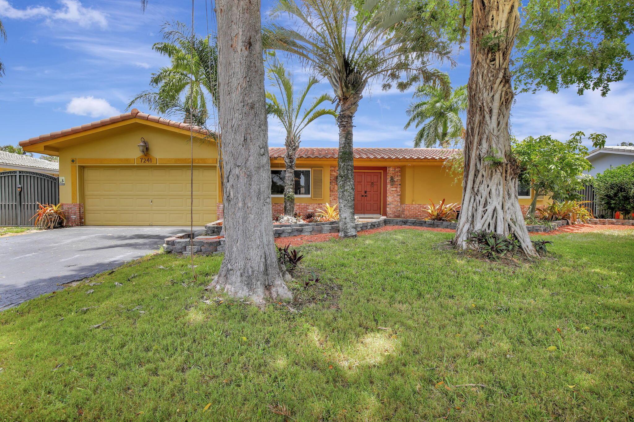 This well-kept four-bedroom, two-bathroom home offers fantastic savings with no HOA fees. It features plenty of storage space for boats and RVs, a securely fenced yard, and 10-foot metal gates. Inside, you'll find a spacious layout with coffered ceilings, a formal dining area, and a kitchen showcasing beautiful Indian granite countertops. Designed for comfort and peace of mind, the home includes high-impact windows, full storm protection, a sturdy barrel tile roof, and a transferable termite warranty. The enclosed flex space is great for a home office, gym, or game room. Outside, relax under a covered pergola with fans and lighting, take a dip in the sparkling pool, or enjoy the peaceful pond with a soothing fountain.