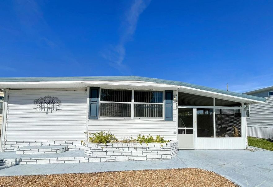 Fully furnished 3-bedroom, 2-bath home with a lovely screened patio and ample parking, conveniently located just steps from the clubhouse and pool. The split-bedroom layout includes a private entrance for added convenience. Additional features include updated windows, a newer main electrical panel, two storage sheds, and room for a patio in the back. Located in a very active community with 3 pools, golf, and numerous activities—and you own the land with very low monthly fees.