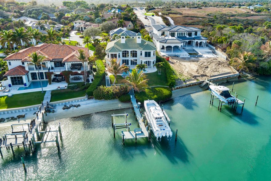 Welcome to 17129 SE Limerick Court, a distinguished and uniquely elevated waterfront home in gated community of Rolling Hills. This is an exceptional opportunity to renovate an existing home on one of Tequesta's most coveted waterfront lots. With direct views of the exclusive Jupiter Island and Jupiter/Tequesta blue intracoastal waterways, the views are unmatched. This property is one of the highest elevated parcels in this area. If you are envisioning a coastal modern estate or a Spanish Mediterranean  home, the opportunities for creativity are endless. Property is ready for a complete interior renovation and comes with approved plans ready for submittal to receive permits. The existing configuration is 4 Bed | 4 Bath | 2 Half Bath, pool, spa, fully equipped dock with two lifts.  Can accommodate a 65ft boat. Builder can provide detailed construction costs and timeline. Reach out today!
