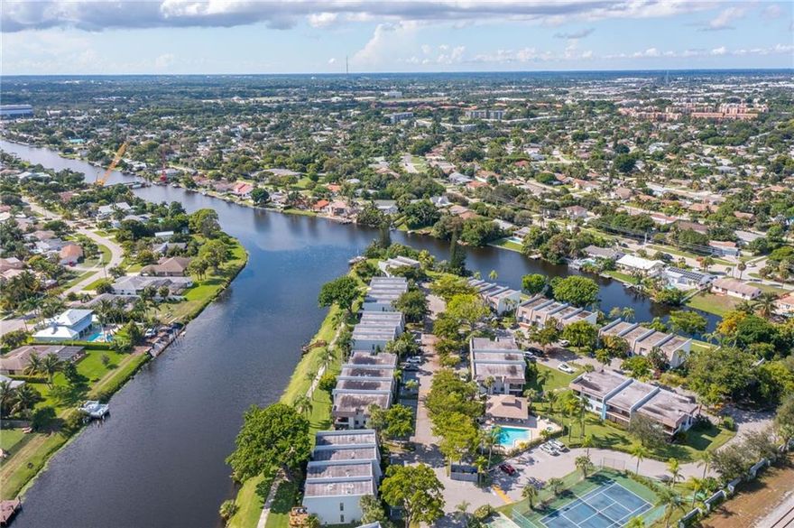 Stunning rarely available remodeled unit,located on a brackish water peninsula. The condo is situated inside a gated community, which is boutique style & has only 53 units. Next to the border of Boca Raton. Can rent out ASAP! Extensive renovations,top to bottom. Brand new AC w/UV light & tankless water heater. Interior doors 8 ft tall & extra wide. Double sided quartz island w/real shaker wood cabinets. Induction stove. Over $100k in renovations done. Nearby Whole Foods,Trader Joe’s,The Fresh Market,shopping & 10 mins to Downtown Delray Beach. 2 parking spaces infront of your unit & plenty of guest parking. All brand new top of the line black SS appliances. Great place to paddleboard. Impact windows & doors. Water, sewer, trash & basic cable included. Check out video walk through tour!! Will not last!!