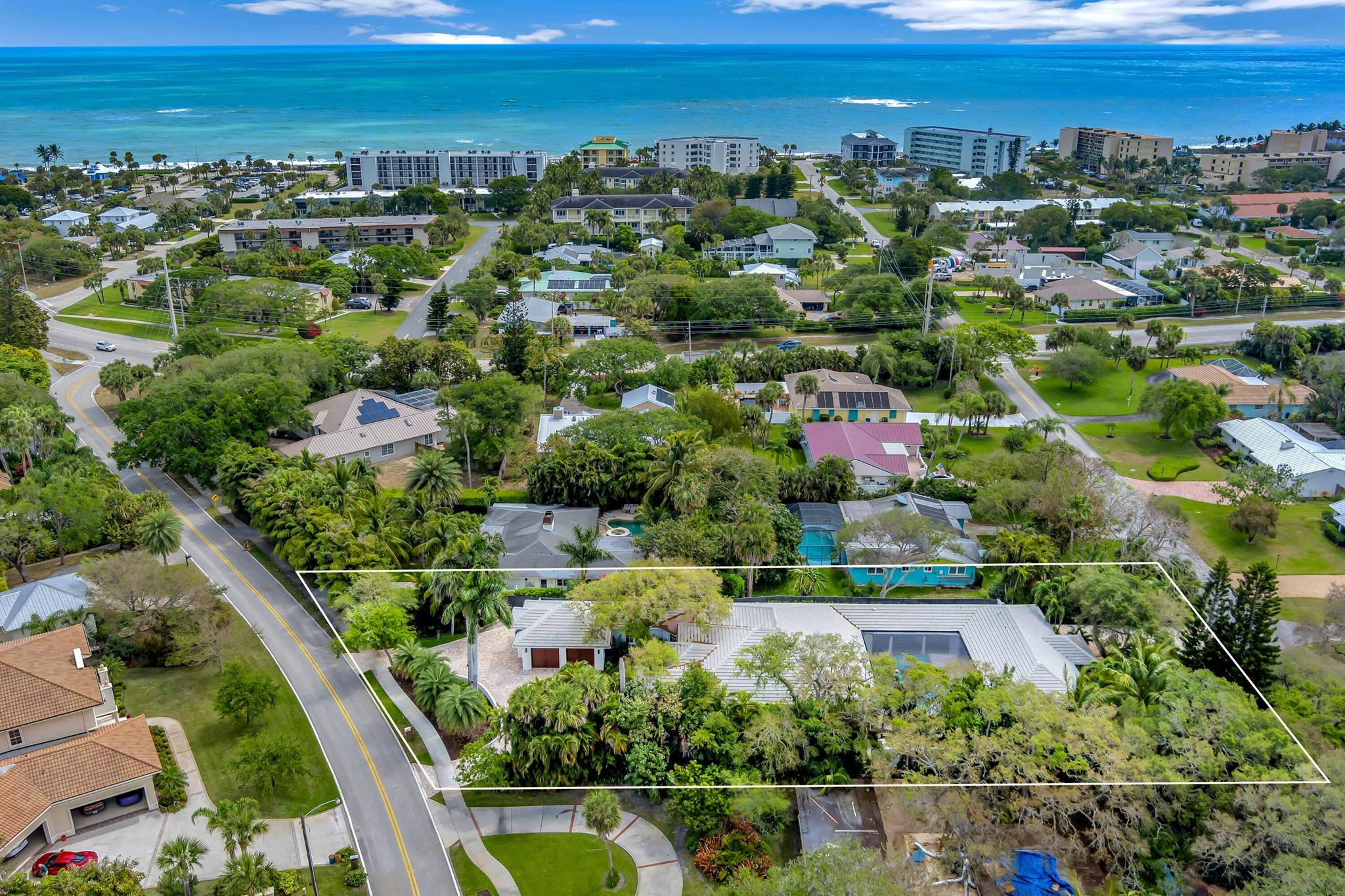 2025 Roof! Experience luxury in this Central Beach estate! 3/3.5 main home (2018) & 2/2 guest house offer vaulted ceilings, chef kitchens, upgraded appliances, lighting, custom molding, & exquisite flooring. Outdoor amenities: shared heated pool, summer kitchen, dining area, & fireplace for year-round entertainment. Ensuite bedrooms, fenced yard, spacious laundry room. A stroll away from parks, beaches, & restaurants. Guest house has private driveway access to Conn Way, main home features 2-car garage w/private driveway access to Live Oak Road. Tailored for ultimate relaxation & convenience.