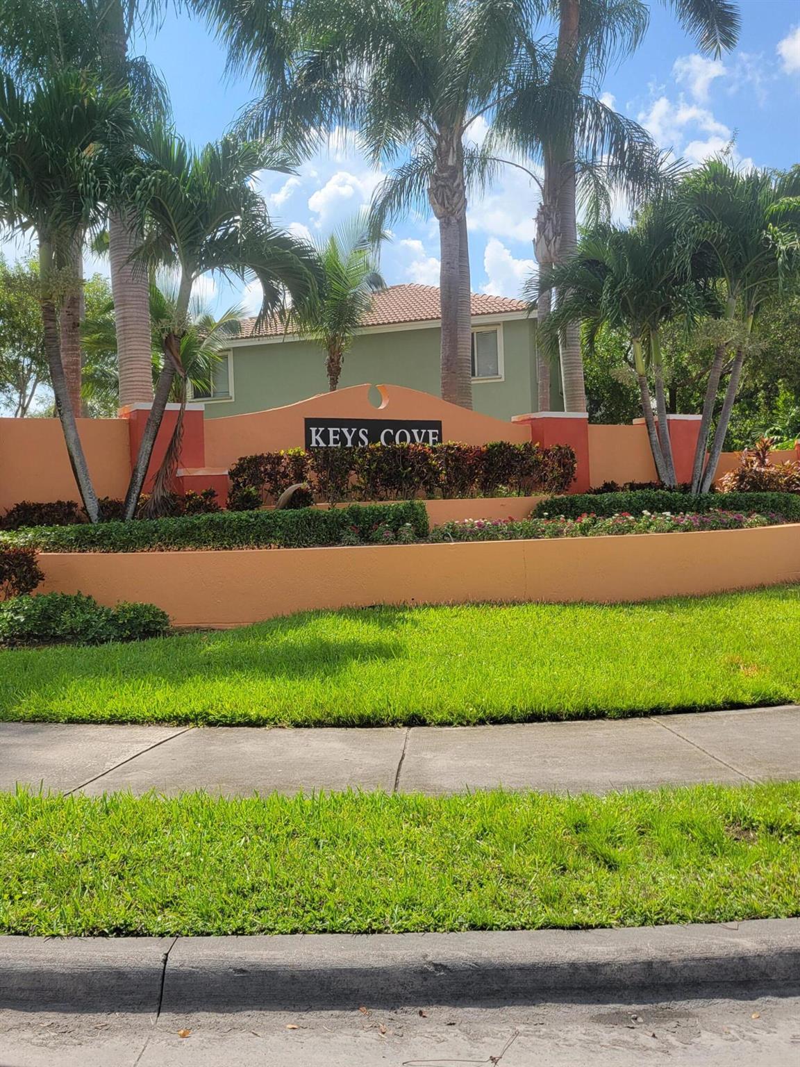 Well-kept gated community with pool, nice lakes and recreational areas. The unit has 3 bedrooms on the ground floor and 2 bathrooms. The master bedroom has updated flooring. The additional two bedrooms have new carpet. There is a storage shed in the yard. 2 parking spaces assigned directly in front of the unit. Very close to Turnpike. A Publix supermarket is a couple of blocks away.