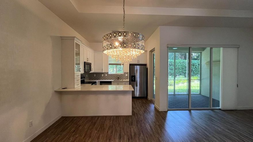 Charming 3-Bed, 2.5-Bath Townhouse in the Heart of Wellington! Welcome to a beautifully townhouse located in one of Wellington's most sought-after neighborhoods. This spacious home features an open-concept floor plan, perfect for both relaxing and entertaining. Enjoy a modern kitchen with stainless steel appliances, granite countertops, and a breakfast bar that flows seamlessly into the living and dining areas. Upstairs, the large primary suite includes 2 walk-in closet and en-suite bath with dual vanities. 2 additional bedrooms offer plenty of space for family, guests, or a home office. Additional highlights include a private patio, in-unit laundry, ample storage, and dedicated parking.easy access to top-rated schools, shopping, dining, equestrian venues, and major highways.