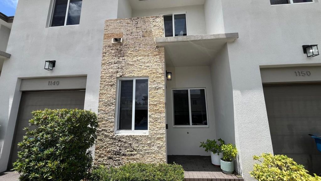 Photo of 1140 Pioneer Way #1140, Royal Palm Beach, FL 33411 (MLS # R11065182)