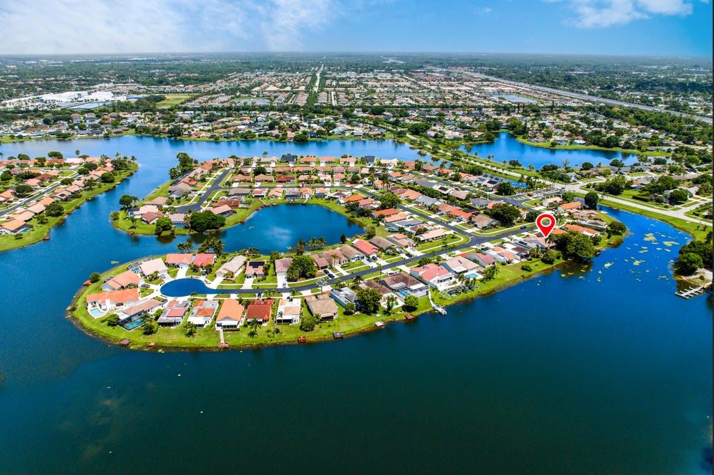 Photo of 8409 Bonita Isle Drive, Lake Worth, FL 33467 (MLS # B26066005)