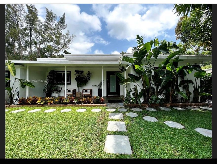Come to see the beautiful paradise located in West Miami Shores. The house has a mother in law suite with separate kitchen , full bathroom , refrigerator , and separate exit door that can be used as an Air BNB with plenty of parking . This tastefully renovated 3BR/2BA with luscious landscape and open front porch welcomes you into a modern open plan kitchen with European style cabinetry including a recessed remote control vent, state of the art Italian appliances and wine fridge. Installed in each room custom 9' tall closets. Impact windows-doors, concrete with resin flooring. Plants accent the yard including a deck under a mature mango tree. Enjoy extra privacy with an electrical gate and hedge surrounding the property. Owners added gutters, improved roof, window screens  and more...