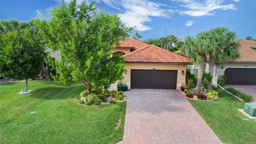 This Home is Incredible! Great Curb Appeal! Totally Upgraded W/Laminated Wood Flooring Throughout! Crown Molding! Upgraded Stainless Steel Appliances/Etched Glass Pantry Doors W/Pantry Organizer Shelving/Center Island Overlooking the Family Room & Pool/Patio Area! Upgraded Top of the Line Plant. Shutters Throughout/All Newer Baseboards/Closet Organizers/Main Bathroom Totally Upgraded W/Sep. Tub & Step in Glass Enclosed Shower/Stone Backsplash W/Beautiful Glass Bowl Sinks! Travertine Tile Surrounding the Open Pool W/Outside Summer Kitchen Makes This Home is as Entertaining on the Outside as it is on the Inside! The Heated/Saltwater Pool W/Bubblers is Enjoyable & is the Ultimate in Outdoor Entertainment! Working Cameras in the Home May Stay Along With 3 Flat Screen Tvs. All Impact Win./Doors