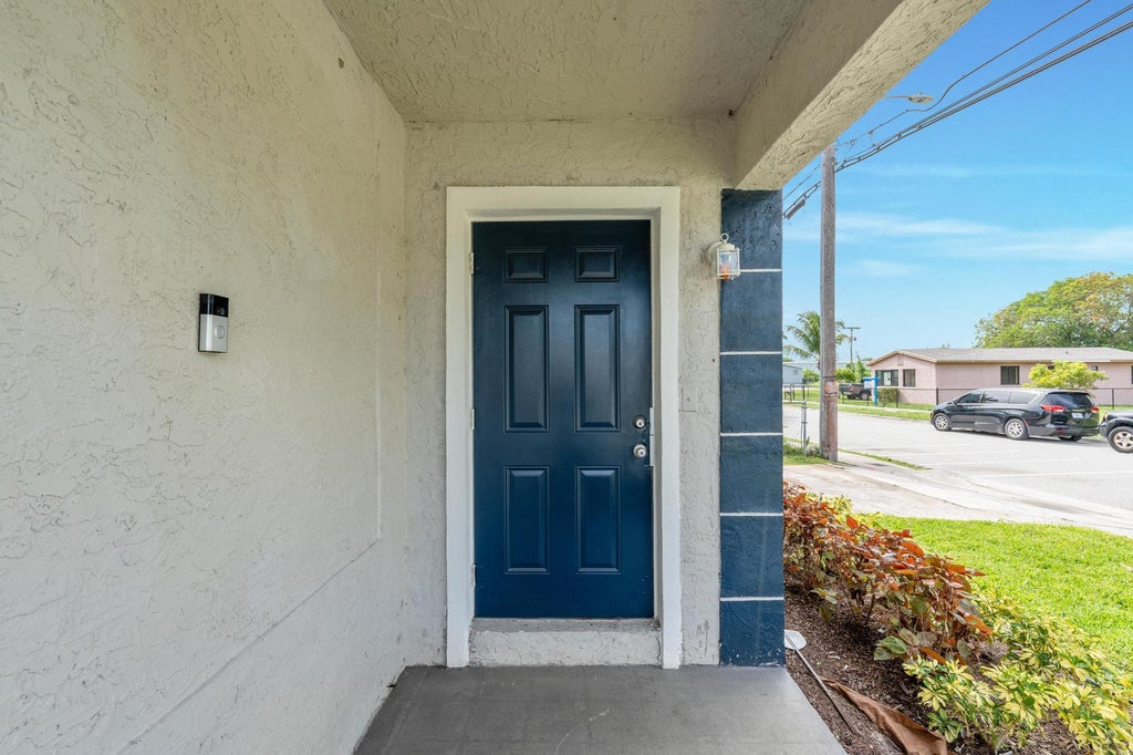 Photo of 741 W 10th Street, Riviera Beach, FL 33404 (MLS # B26027977)