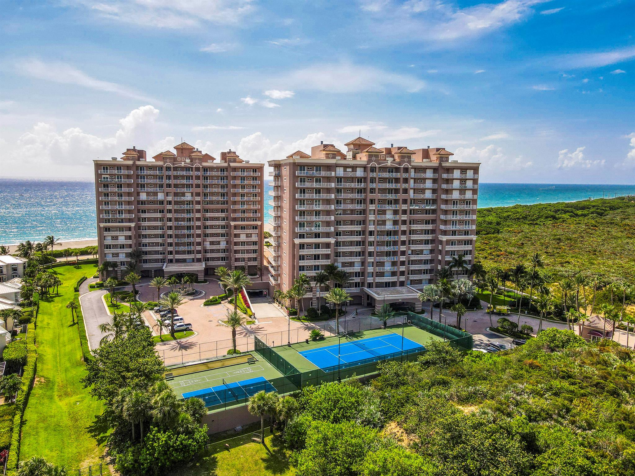Experience luxury oceanfront living in this beautiful residence, located in the most desirable full-amenity condominium complex in Juno Beach. This spacious home offers stunning ocean, pool and garden views, floor to ceiling windows, and an open floor plan designed for both comfort and elegance. Enjoy peace of mind with newer impact glass & doors, automated hurricane shutters, and newer AC & appliances. The home flows flawlessly from the chef's kitchen, great room, owners suite & expansive balcony space. Resort-style amenities include 24-hour security, oceanfront pool/spa, fitness center, tennis/pickleball, golf simulator, beach access, movie theater, billiards, on site concierge & more. Perfectly situated near fine dining, shopping, and golf, this is coastal living at its finest.