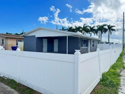 Photo of 818 Avenue U, Riviera Beach, FL 33404 (MLS # F10532598)