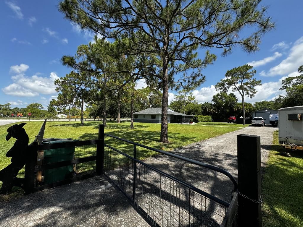 Photo of 12969 N 56th Place N, The Acreage, FL 33411 (MLS # R10993498)