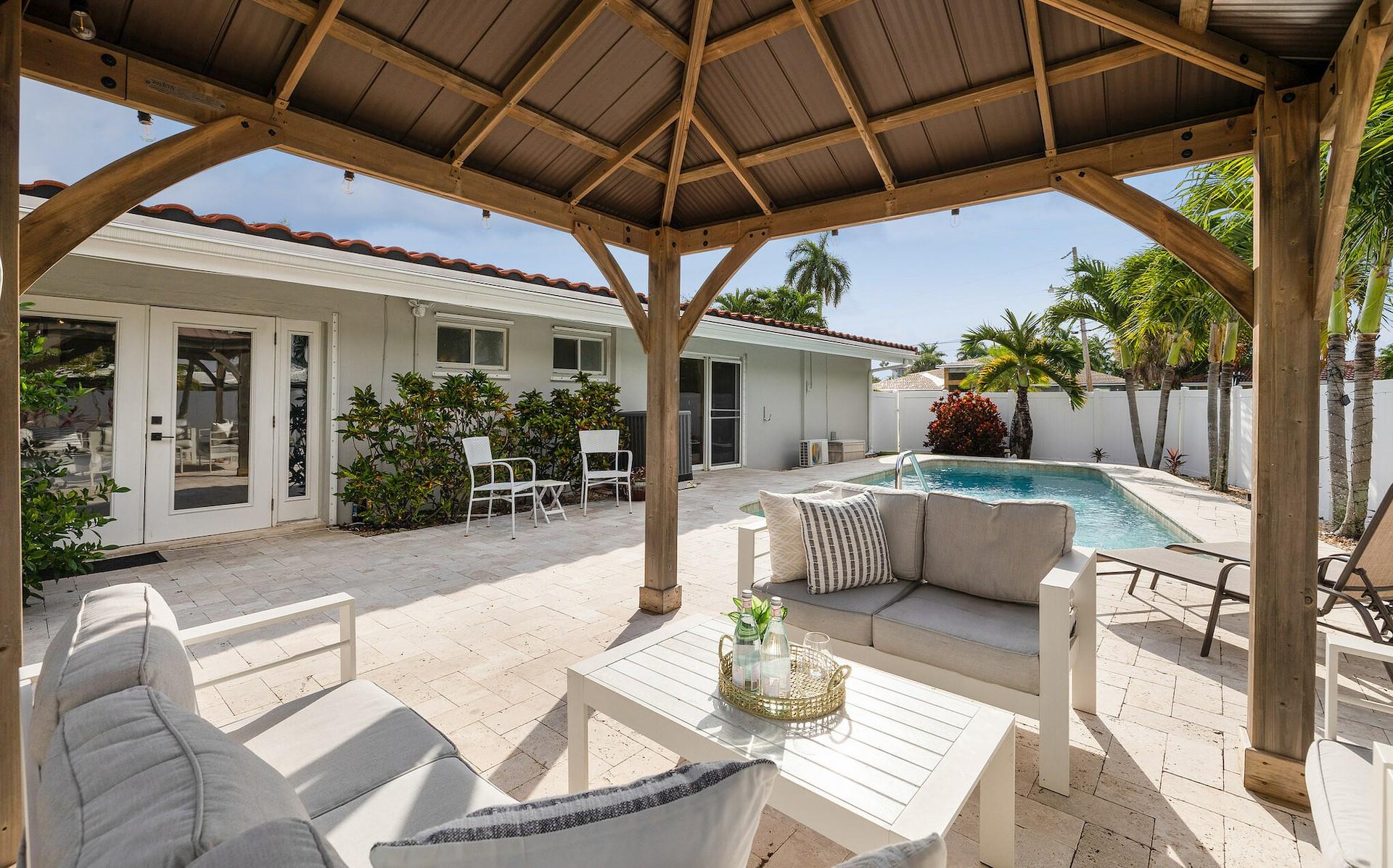 LIVE IN THE GATED WATERFRONT COMMUNITY OF BAL HARBOUR. PRIME LOCATION! LIVE THE VACATION LIFESTYLE IN THIS AMAZING 5 BEDROOM 3BATH RANCH. THIS TURNKEY PROPERTY WAS A TOP PRODUCING AIRBNB WHICH IS DESIGNER DECORATED AND READY TO RENT OR LIVE IN. WALKING DISTANCE TO WHOLE FOODS, SHOPPING AND DINING AND ONLY A FEW MINUTES TO FAMED LAS OLAS BOULEVARD. CHEF'S KITCHEN. ALL THE RESORT STYLE AMENITIES ; HEATED POOL W/ TRAVERTINE DECK & PERGALA. BILLARDS, SKYLIGHTS. VAULTED CIELINGS WITH TOUNGE & GROOVE. ASTRO TURF BACKYARD WITH A CUSTOM PUTTING GREEN, DECK AND BBQ. FURNITURE IS NEGOTIABLE. DONT MISS THIS OPPORTUNITY!