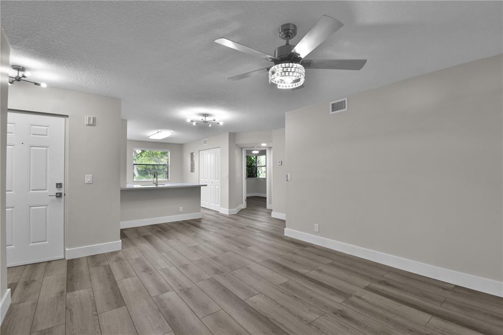 Remodeled unit in Grand Oasis. Washer and Dryer in unit, New Kitchen with quartz counter tops, new stainless steel appliances, new vinyl plank flooring, new interior paint, recessed lighting, new interior doors, new base boards, new lighting fixtures, new window treatments, new lighting fixtures, new ceiling fans, Newly screened patio, new bathroom fixtures and lighted mirrors. Updated bathrooms, new a/c and water heater!