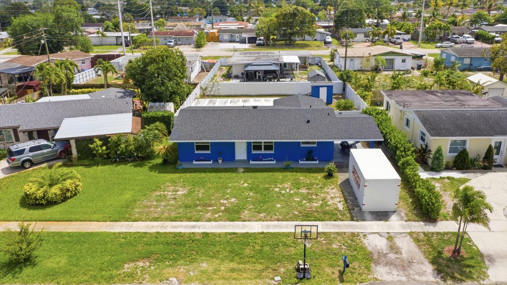 Photo of 5792 Tarragon Drive, West Palm Beach, FL 33415 (MLS # B26012431)