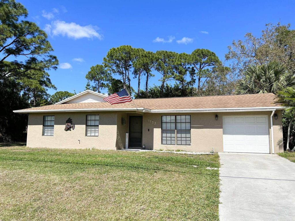 Photo of 1733 SW Capehart Avenue, Port Saint Lucie, FL 34953 (MLS # R10778608)