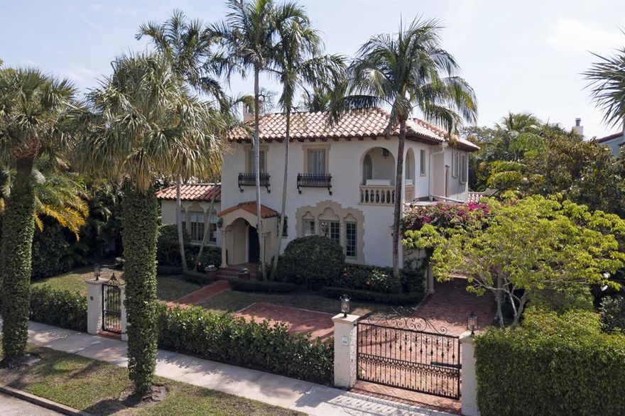 Built in 1925 as one of Historic El Cid's trophy properties with 4 bedrooms and 2.5 baths, a large guest house with 1 bedroom and 1 full bath, air conditioned garage and a beautiful heated swimming pool.From the arched double entry door, the elegant working fireplace, the pecky cypress ceilings,  the glistening oak hardwood floors, the huge Porte cochere, the double stairway, the gourmet kitchen with custom cabinets to the soaring curved ceilings, the architectural details are plentiful in this classic lake block Mediterranean masterpiece all of which have been meticulously preserved as the home have been modernized and updated. There's a covered poolside loggia right off the kitchen that is perfect for dining alfresco.