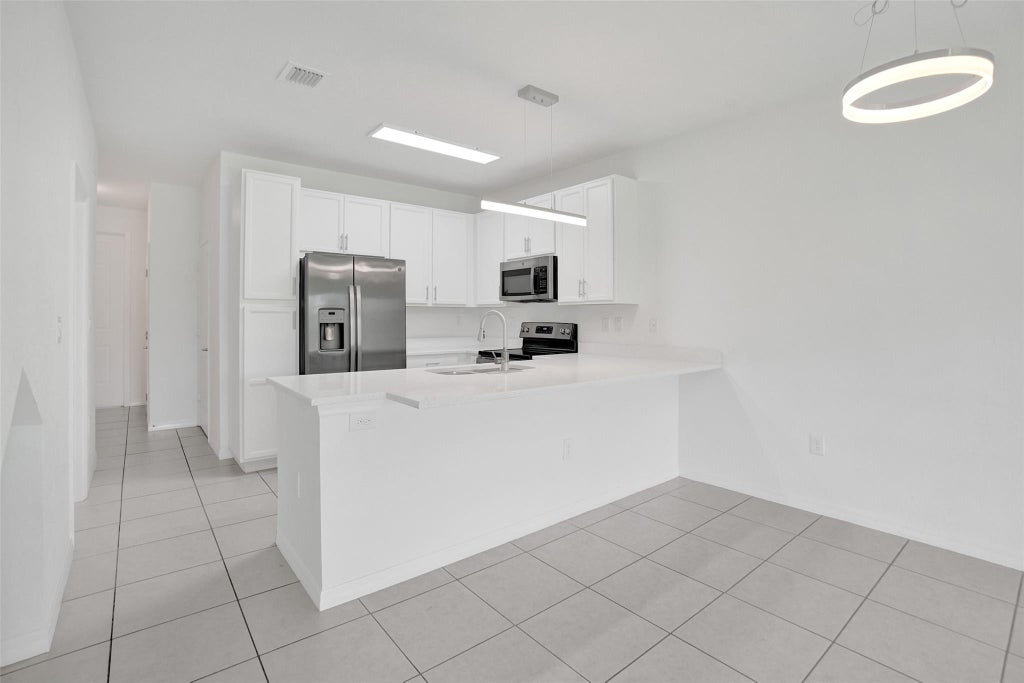 Photo of 4748 SW 63rd Terrace, Davie, FL 33314 (MLS # B26080272)