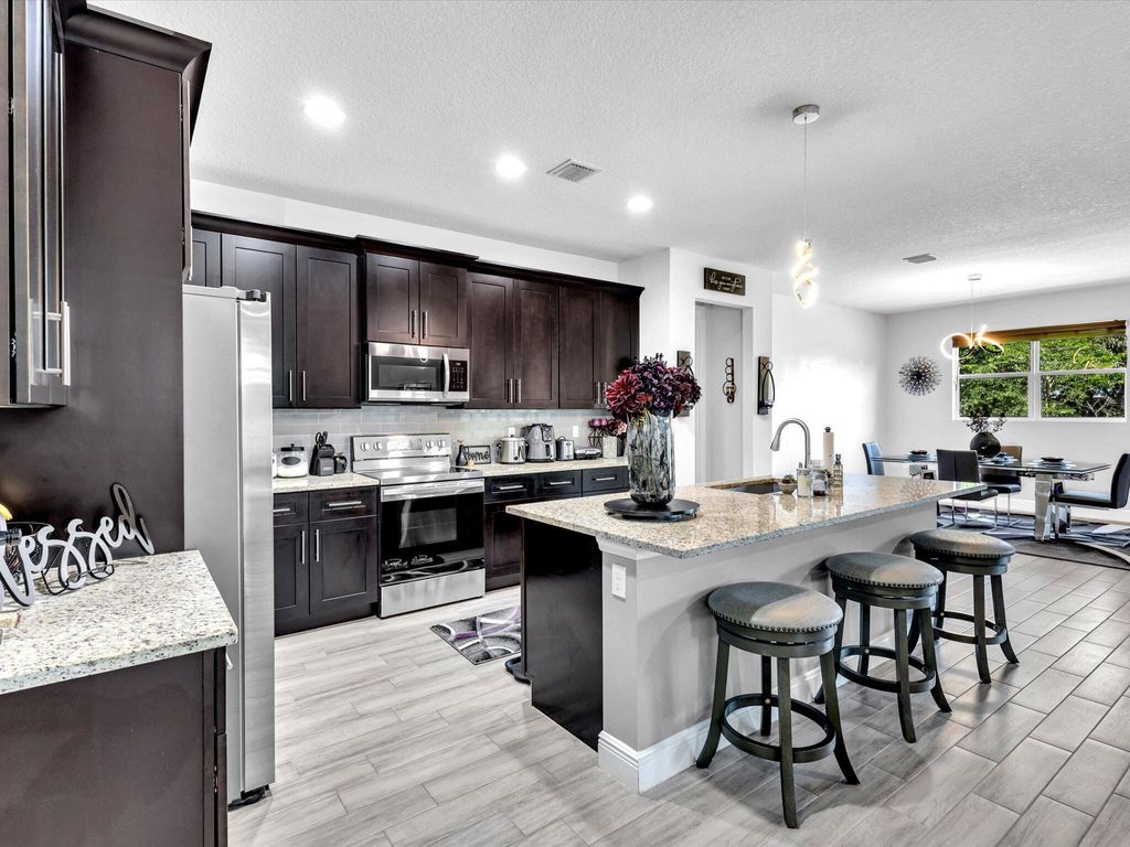 Photo of 762 SE Atlantus Avenue, Port Saint Lucie, FL 34953 (MLS # R10984027)