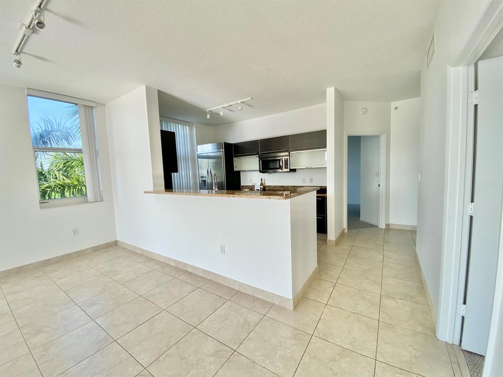 Massive 2/2 CORNER unit, with bright, open living areas. Floor to ceiling windows & huge wrap around terrace with awesome city views. Gourmet kitchen with granite counters, stainless appliances, wine fridge & modern wood cabinetry. Large, split bedrooms, walk in closets & luxurious primary bath with soaking tub, glass shower & dual sinks. Comes with TWO garage parking spaces, though feel free to sell your cars because from here, you are just steps to downtown's incredible restaurants, shops & entertainment. CityPlace South Tower boasts complimentary valet, 24 hr staff, on site management, state of the art fitness center, hot tub, spa rooms, clubhouse, resort pool with cabanas, outdoor kitchen, Intracoastal views & more. Rare opportunity to live downtown AND in an A rated school zone