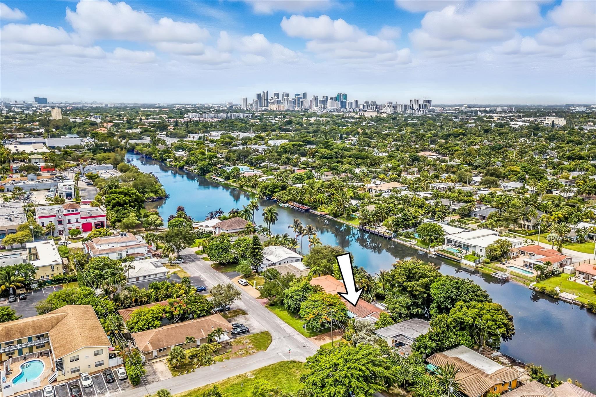 LOCATION, LOCATION, LOCATION!!!! This beautiful 2/2 LAKE FRONT home comes with a 1 car garage. It also features designer touches throughout and is located in the fabulous Poinsettia Heights neighborhood. Sit on your back patio and watch the gorgeous Florida sunsets while enjoying the spectacular water view. Some unique features include: An open sleek kitchen; REAL WOOD FLOORING throughout the main living areas; Solid 8 foot wood doors enhancing the feel of more space; an extra large laundry room with an amazing storage space; IMPACT WINDOWS AND DOORS; Water views from almost all rooms; Real Chicago brick driveway, patios and walkways; Lake fed sprinkler system; Newer exterior lighting; Minutes to the beach. Walk to restaurants and shops! Don't miss out, call today! Easy to show!
