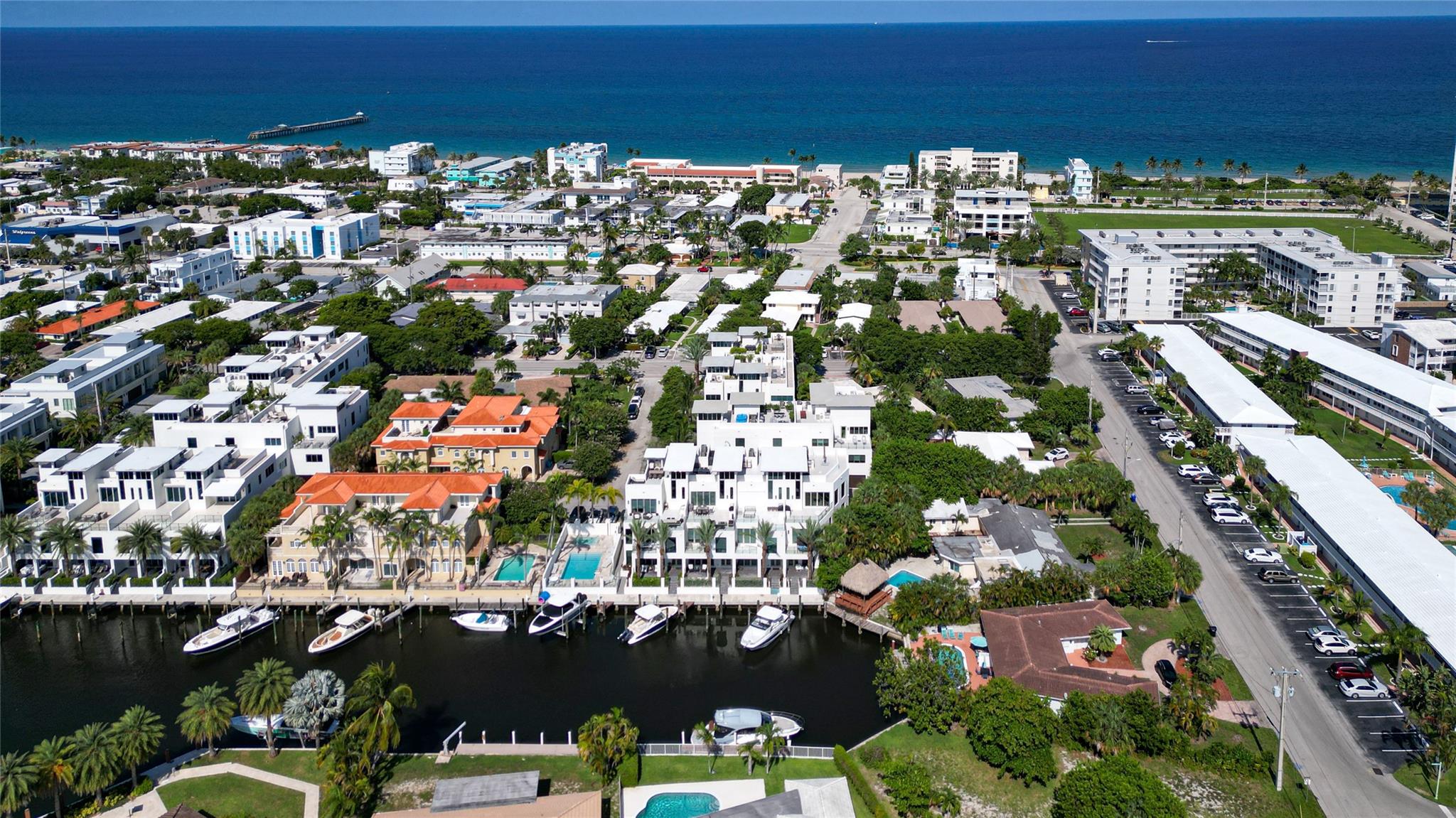Completed in 2022, this 4-level townhome in Lauderdale-by-the-Sea blends modern luxury with laid-back beach living. Featuring 3 spacious bedrooms, 3.5 bathrooms, and elevator access to every floor, the home includes a chef’s kitchen, open living area, private terrace, and full guest suites. The top-level primary retreat offers dual walk-ins, a soaking tub, double vanities, and a spa-style shower. Enjoy sweeping rooftop views with a built-in summer kitchen, grill, and pizza oven—perfect for entertaining. Additional upgrades include a whole-home water filtration system and custom garage storage. Community perks: waterfront pool, spa, guest parking, and available boat slips. Walk to beach, shops, and dining.