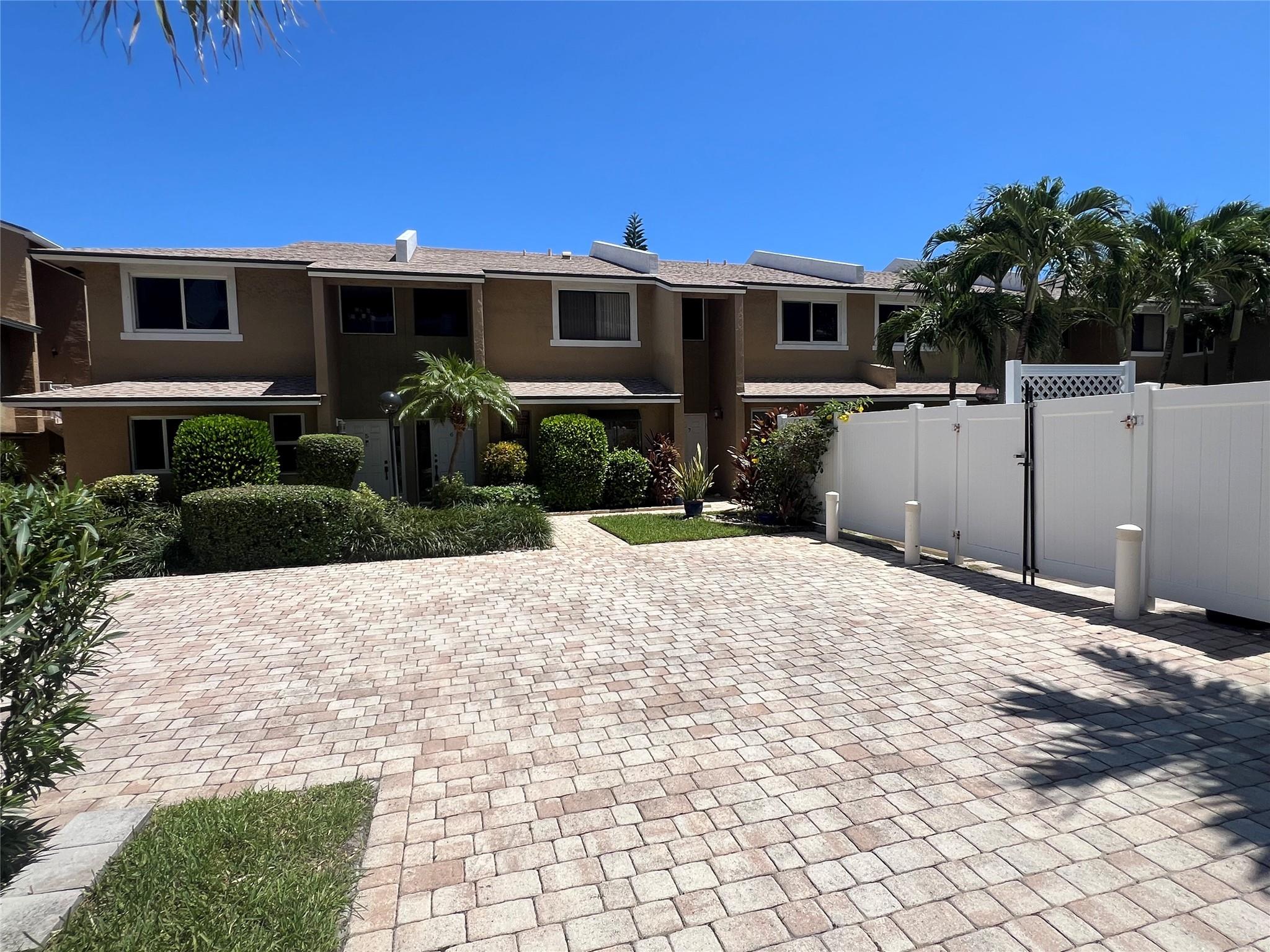 Rarely available oceanfront corner unit town-home. Located in a lushly landscaped private complex with only thirteen units. This property features an updated kitchen with granite countertops, stack washer & dryer, huge living room, and large private fully fenced patio. Upstairs there are two large bedrooms with two full bathrooms. The master has a huge walk-in closet and a private balcony as well. New A/C unit, and the whole interior was just completely painted. Covered assigned parking space just outside your front door! Enjoy oceanfront living for a fraction of owning. Lots of new shops and restaurants close by. Offered furnished or unfurnished. Don't miss this tremendous opportunity to live at the beach!