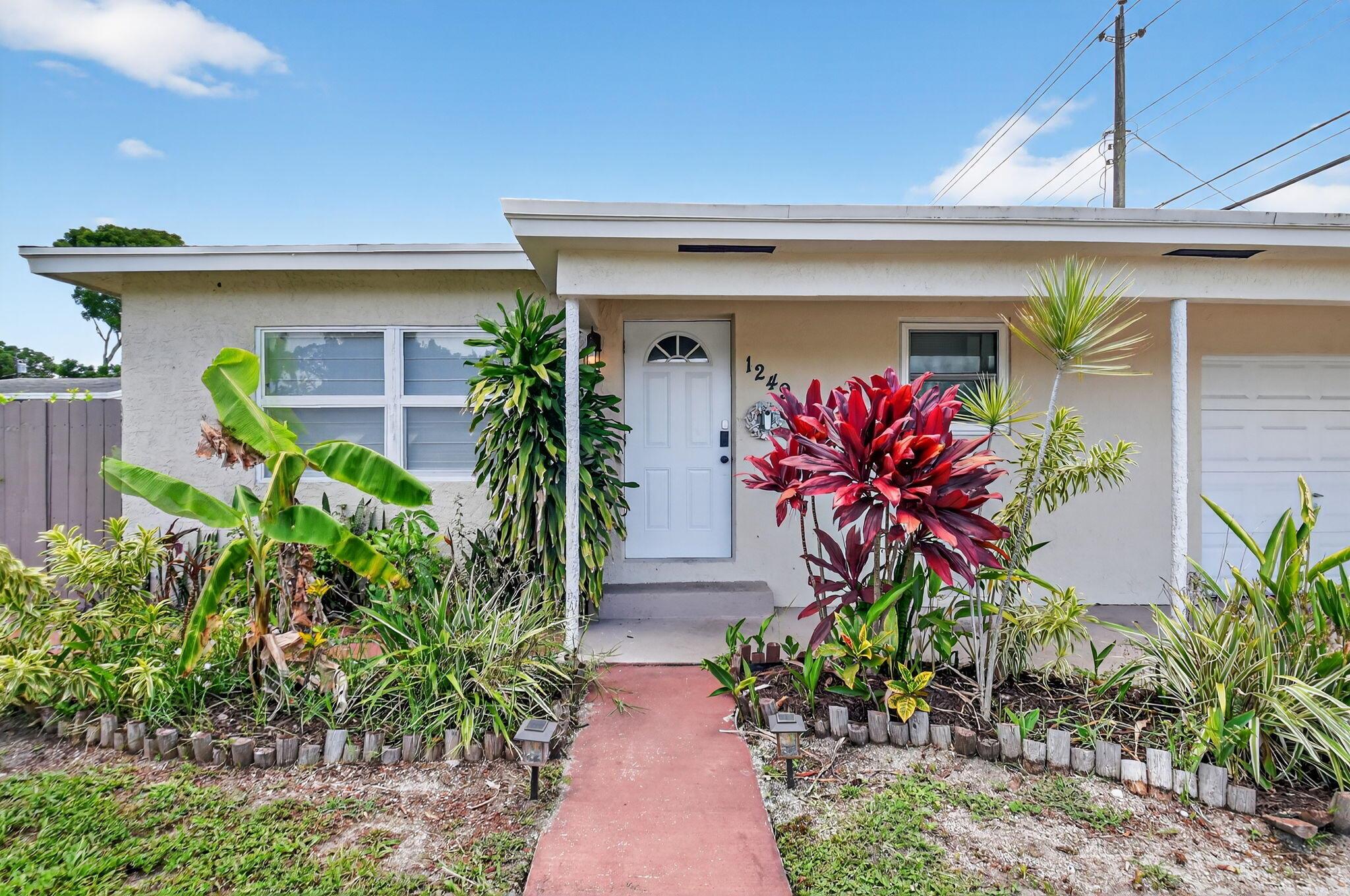 QUICK MOVE-IN, NO HOA APPROVAL REQUIRED! Stunningly renovated 3-bedroom, 2-bath home with a 1-car garage in desirable Lake Worth Beach neighborhood with NO HOA! Featuring a newer roof, newer A/C, impact windows, and countless upgrades throughout the home. Running water in the house is connected to a water filtration system. Enjoy the privacy of a very spacious, fully fenced backyard equipped with an outdoor shower. Perfect for entertaining your family and guests.