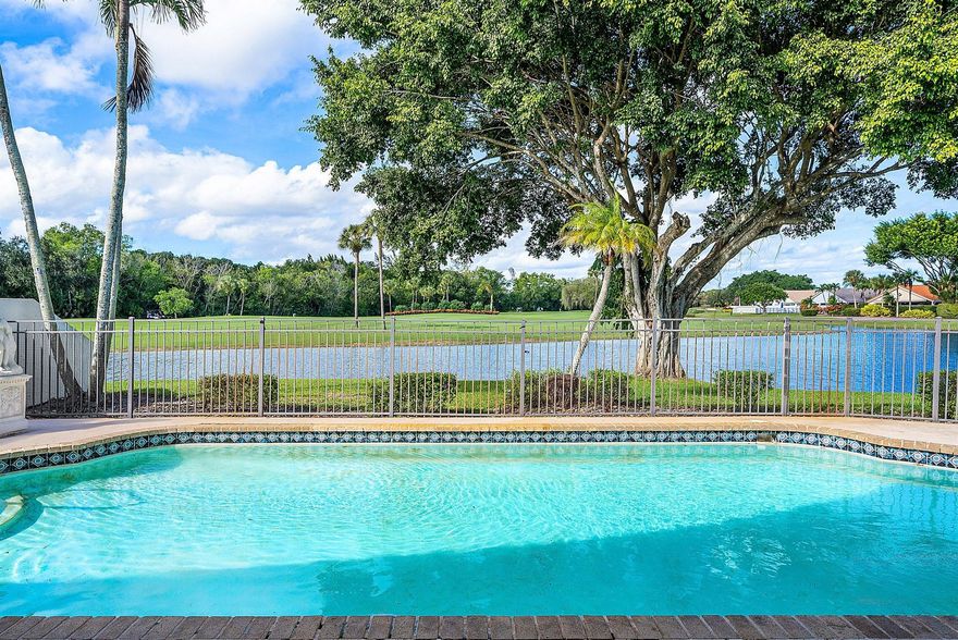 Nestled on a quiet cul-de-sac in the desirable Boca Woods Country Club, this unique (2 bedroom/3 bath + Family Room and Den) sits on an expanded pie-shaped lot. The split floor plan offers privacy, while the outdoor living space features an oversized pool and the most stunning water and golf views, creating a breathtaking setting from the pool area. Boca Woods is an all age Country Club Community which offers resort style amenities, including two championship golf courses, Har Tru tennis courts, pickleball courts, state of the art fitness center, spa, game room, fully renovated clubhouse with fine dining and much more! Mandatory Country Club membership required $120,000.