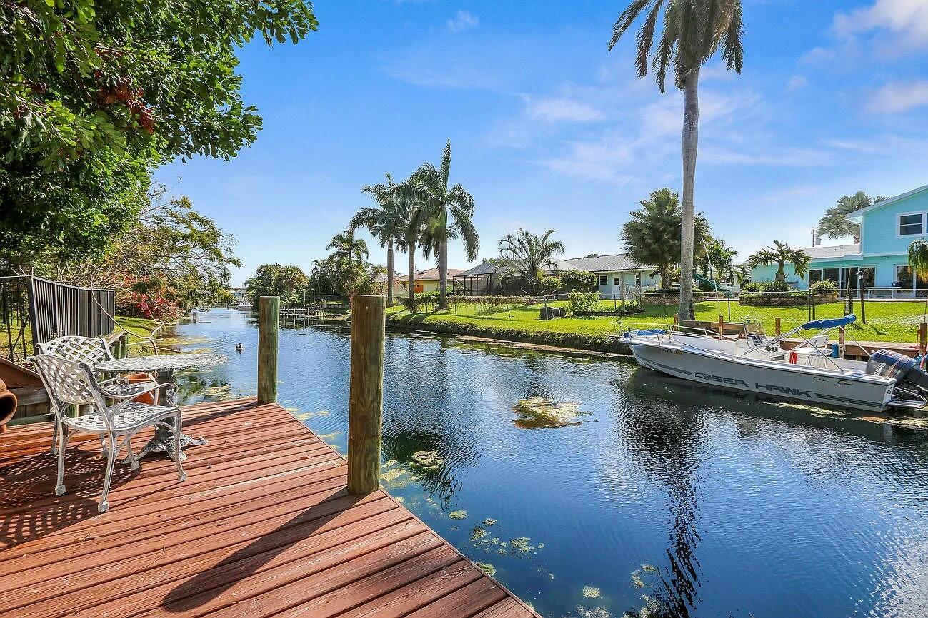 Discover paradise in this beautiful 4/2 waterfront home on a peaceful canal in Juno Beach! This gem offers the ultimate Florida lifestyle with a private dock for fishing, paddle boarding, and kayaking right from your backyard. Just a mile's stroll to the pristine beach and minutes drive to premier shopping, dining, and vibrant nightlife, this location offers both tranquility and convenience.Inside, find spacious living areas, upgraded modern kitchen, & room to entertain w/ water views throughout. A 2.5-car garage provides plenty of storage for vehicles & beach gear. Enjoy a piece of waterfront luxury & endless adventures right at home, with a large back porch that opens to a tropical free flowing pool, complete with a grotto waterfall.Seasonal: $9,500 mthAnnual: $6,500 mth