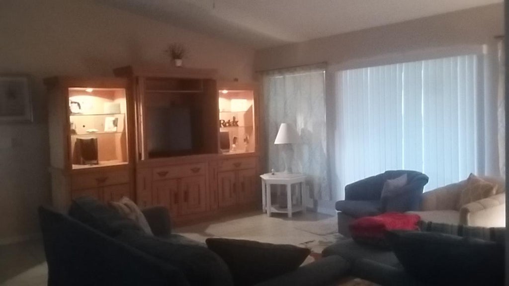 Photo of 992 SW Mccomkle Avenue, Port Saint Lucie, FL 34953 (MLS # R11011572)
