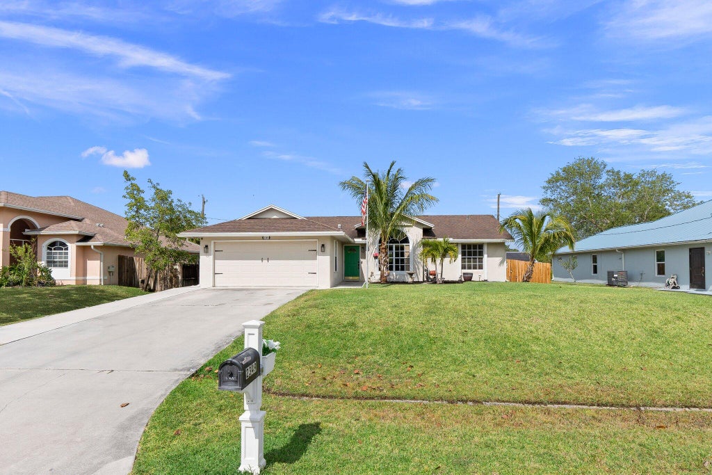 Photo of 2349 SW Vale Street, Port Saint Lucie, FL 34953 (MLS # R10984933)