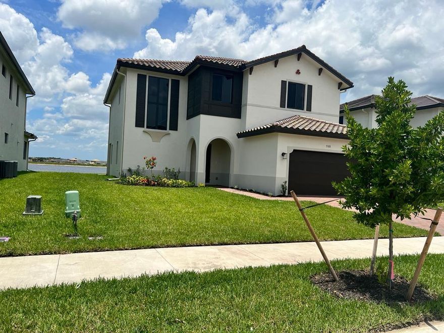 SPACIOUS 2-STORY LAKEFRONT HOME IN AVE MARIA WITH OVER 3,300 SQ. FT. UNDER AIR, 4 BEDROOMS, 3 FULL BATHS, AND MODERN OPEN-CONCEPT DESIGN. LARGE KITCHEN WITH UPGRADED QUARTZ COUNTERTOPS, ISLAND, OVER-THE-RANGE OVEN AND MICROWAVE FLOWS INTO LIGHT-FILLED LIVING AND DINING AREAS WITH TILE FLOORS AND HIGH CEILINGS. ONE BEDROOM AND FULL BATH DOWNSTAIRS ARE PERFECT FOR GUESTS OR MULTIGENERATIONAL LIVING, PLUS AN UPSTAIRS FAMILY ROOM AND CONVENIENT UPSTAIRS LAUNDRY. WHOLE-HOUSE IMPACT WINDOWS PROVIDE PEACE OF MIND. ENJOY WALKING AND BIKING TRAILS, PARKS, SHOPS, RESTAURANTS, CAFES, AND A SEASONAL FARMERS MARKET JUST MINUTES FROM HOME IN THIS VIBRANT MASTER-PLANNED COMMUNITY.