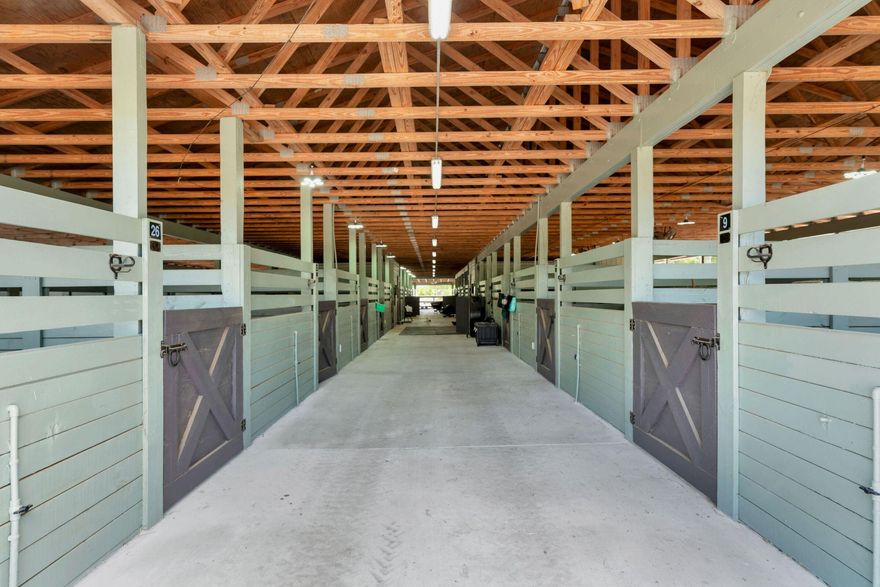 Entire 5 acre commercial horse farm, now offered for lease. Assets include: 11 Stall Center Aisle Barn: Water & Electric 38 Stall Center Aisle Barn: Water & Electric. Fly System. Bathroom & W/D Hook Up 4 Stall Board/ Run In Stables Stalls are 12x 12 2 Mobile Homes: 2 Bed/1 Bath Each Private 3/2 House: Custom woodwork, high ceilings, screened in patio 2 Arenas: Number one white sand footing with screenings. 120x 220 Dressage and 60 x 170 Jumping 1 Round Pen: 60 FT Trailer Storage 3 RV Spaces 14 Paddocks: Room to Add 6-8 More Along East Side of Property. Gated Entry, Fully Fenced Tack/ Feed Rooms Wash Racks Jumping Equipment New Commercial Grade Water System