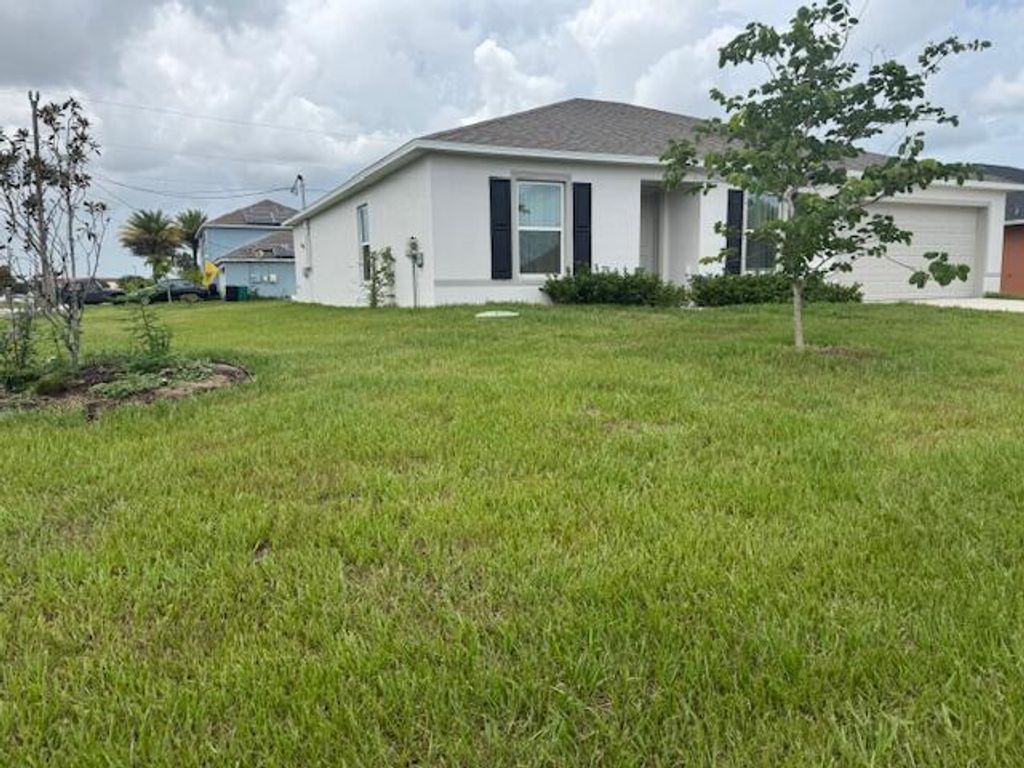 Photo of 591 SW Halifax Avenue, Port Saint Lucie, FL 34953 (MLS # R11104626)