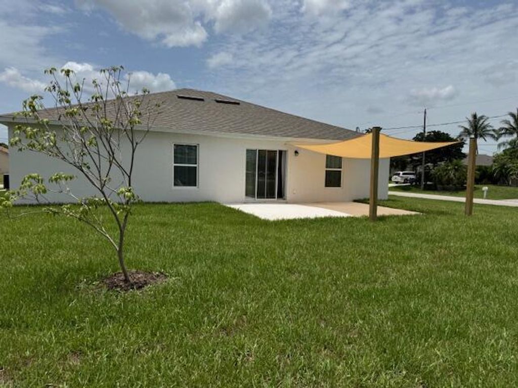 Photo of 591 SW Halifax Avenue, Port Saint Lucie, FL 34953 (MLS # R11104626)