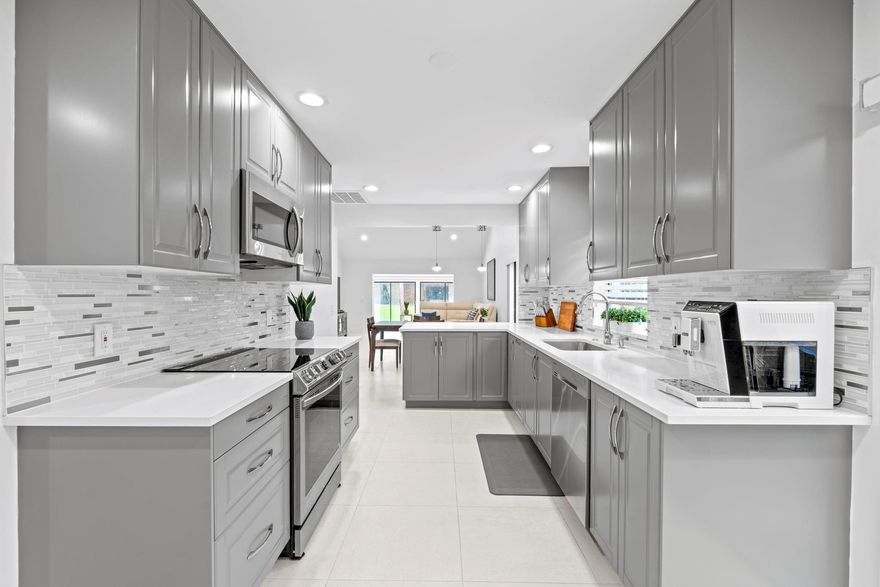 Stunning 2 Bedroom 2 Bathroom villa with 1856 SQ FT Under AC located in the The Green at Boca Lago gated 55+ community. New Roof Installed IN 2024, Currently Monthly Homeowners Insurance Seller Is Paying $1200.00 Per Year For Contents Coverage. Tastefully remodeled villa with high end appliances and modern finishes with an electric car charger. Community is 24 hour manned gated with convenient access to nearby shopping, dining, parks, medical and highways.  Building Is Insured through condo association fees of $880.00 per month. Easy to show.