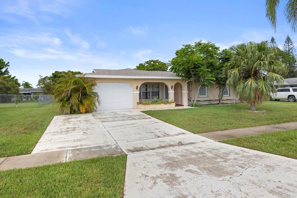 Photo of 740 SW Goodrich Street, Port Saint Lucie, FL 34983 (MLS # R11098933)