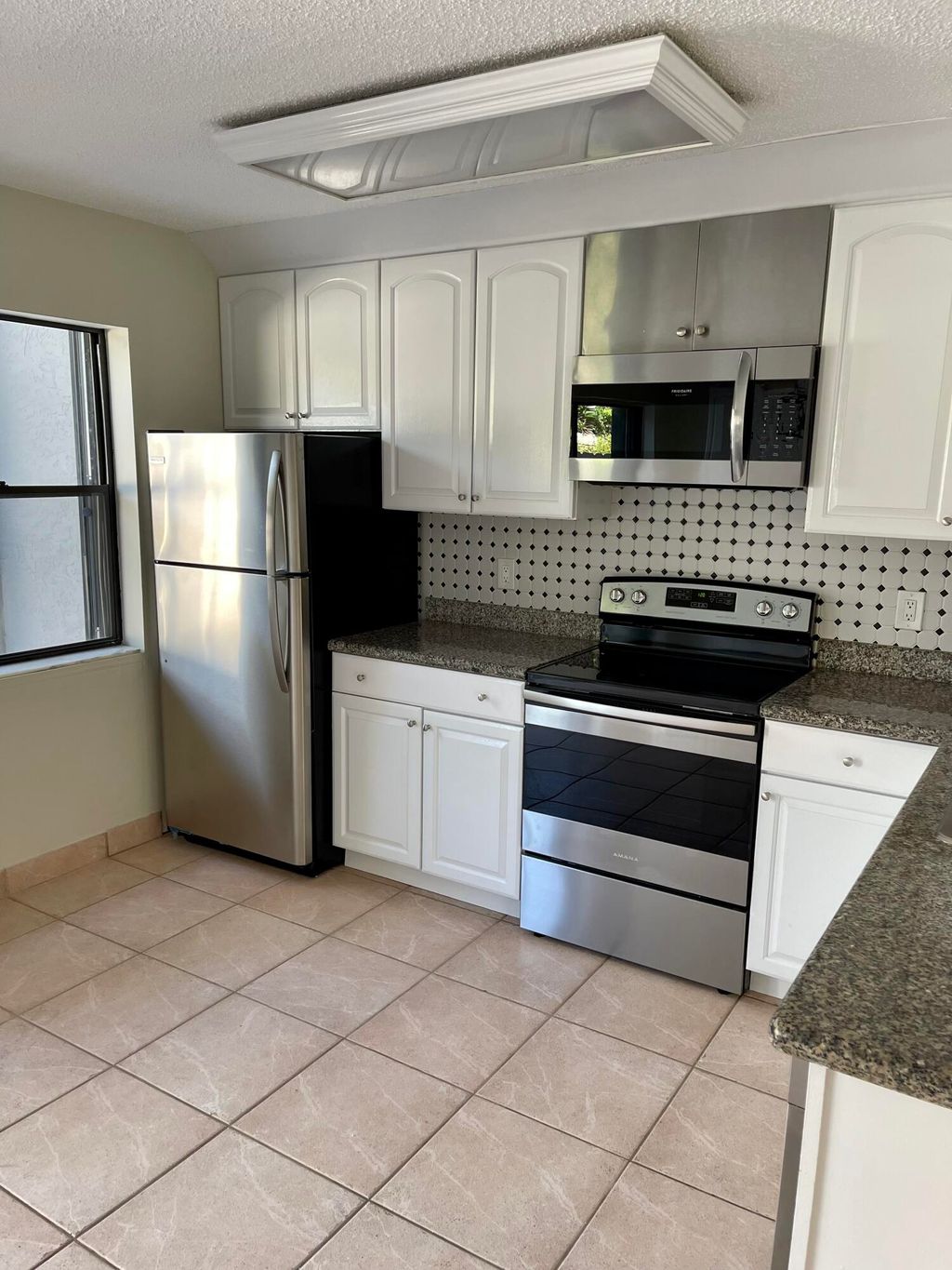 Photo of 308 Sandtree Drive, Palm Beach Gardens, FL 33403 (MLS # R10777015)