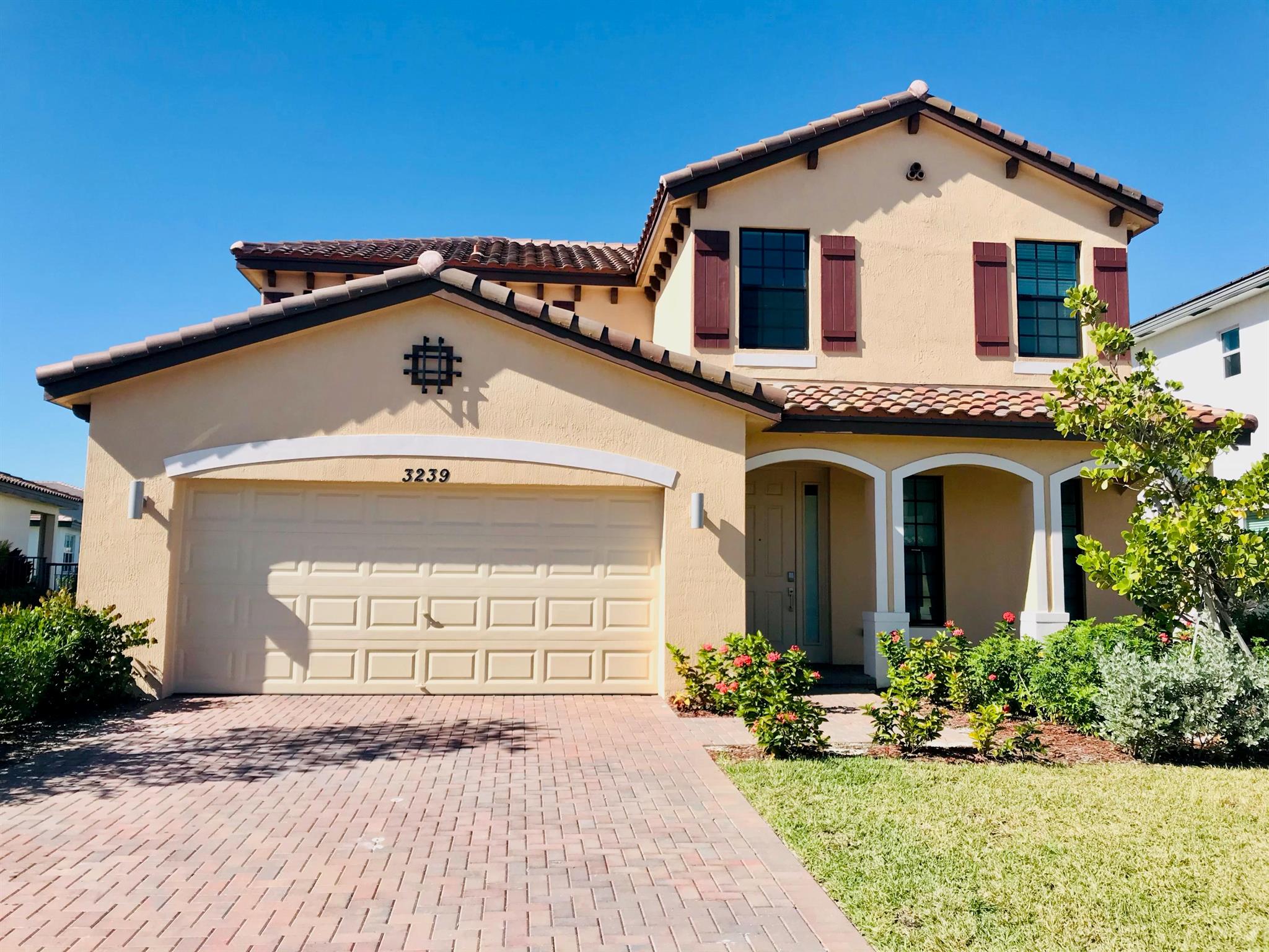 Beautiful lake-view home in a gated, family-friendly community. This light and bright floor plan offers a 1st-floor bedroom with full bath, while the upstairs features a generous master suite plus two additional guest rooms and a full bath with dual sinks. The kitchen showcases granite countertops and stainless-steel appliances, and a large laundry room adds convenience. Walking distance to HL Johnson Elementary and close to parks, dining, museums and South Florida's beaches. The gorgeous Cabana Clubhouse is a sun-filled resort-style escape with pool, sun deck and tennis courts--perfect for quiet relaxation or lively family fun. Royal Palm Beach is the ideal place for your family to live, grow and love.