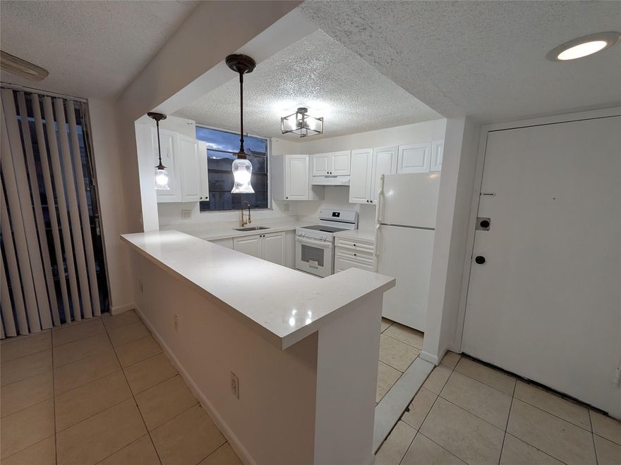 Turnkey Key Ready! Large two-story 3 bed/2.5 bath condo townhouse located on the second floor of a 3-story building in an all-age gated community. Nice and bright unit with updated kitchen and bathrooms. the kitchen is opened up to a large living room area and dining room area. There is tile flooring throughout and a laundry/utility room with a full-size washer/dryer. Water and sewer included!! PETS ARE NOT ALLOWED. NO RENTALS RESTRICCIONS! It can be rented the first day you own! Great Investment opportunity !!