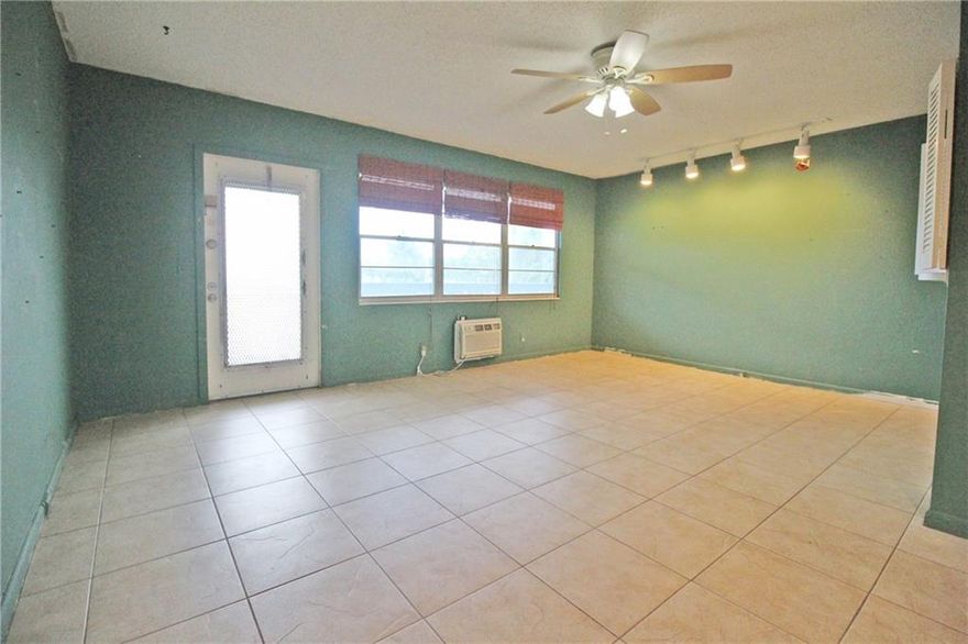 LOCATION! LOCATION!  THIS 1 BEDRM, 1.5 BATH CONDO IS LOCATED ON THE 2ND FLR. IN THE HIGHLY DESIRABLE OAKRDIGE AREA!  POOL DIRECTLY ACROSS THE STREET WITH BUS STOP RIGHT IN FRONT OF THE BUILDING!  SHORT WALK TO CLUBHOUSE!  CERAMIC TILE THRU-OUT, UNFURNISHED AND READY FOR YOUR OWN FINISHING TOUCHES!  2 WINDOW WALL A/C UNITS!  UPDATED KITCHEN CABINETS, FORMICA COUNTERS & BACKSPLASH... NO DOME HERE!! ENCLOSED PATIO WITH NICE GARDEN VIEW! RELAX AFTER YOUR SWIM AT THE COMMON BBQ/PICNIC AREA!!  START LIVING THE ACTIVE SENIOR RESORT LIFE STYLE CENTURY VILLAGE HAS TO OFFER! WITH 24 HR SECURITY, SHUTTLE BUS SERVICE, HEATED POOLS, FITNESS CENTER, FREE MOVIES, SAUNA, RESTAURANT ON SITE & SO MUCH MORE!!!  DON'T MISS THIS GREAT OPPORTUNITY! ASSOC. CLAIMS 55+. NO RENTALS FOR 1 YEAR AFTER OWNERSHIP.